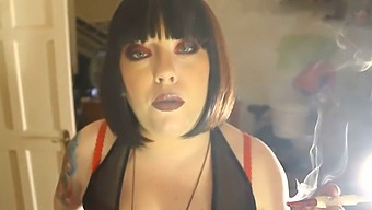 Tina Smua, A Plus-Sized Dominatrix, Indulges In A Filterless Cigarette With A Holder